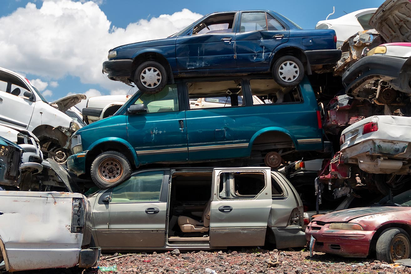 Scrap yard filled with automobiles we towed from Boston, MA and Providence, RI